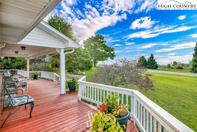 a view of a wooden deck with furniture