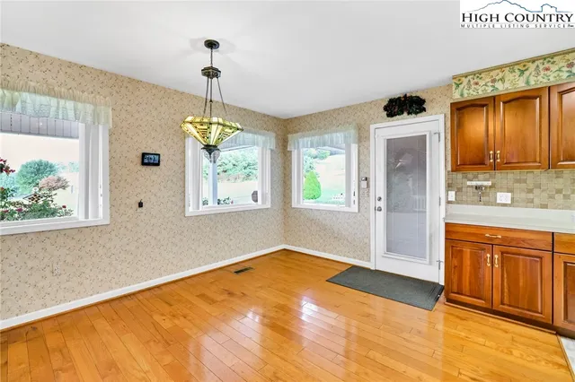 a bathroom with a granite countertop sink a window and a mirror