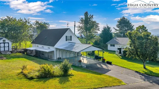 a view of a swimming pool with an outdoor space and seating area