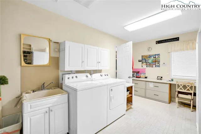 a view of walk in closet with clothes