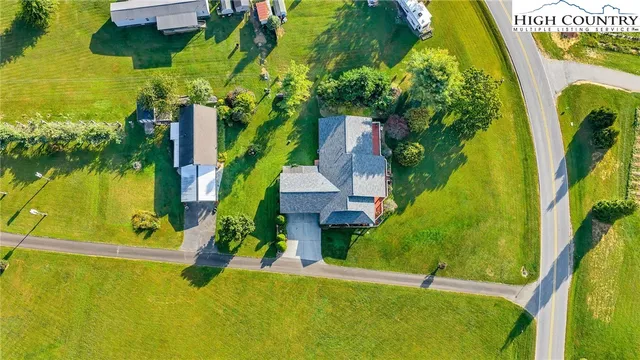 a view of a swimming pool with a yard