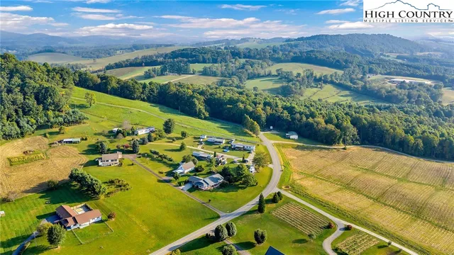a view of a swimming pool with a yard