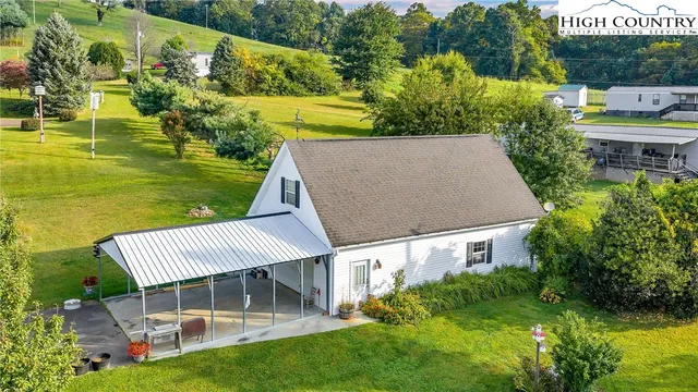 an aerial view of a house having swimming pool garden and patio