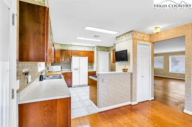 a view of living room with furniture and flat screen tv
