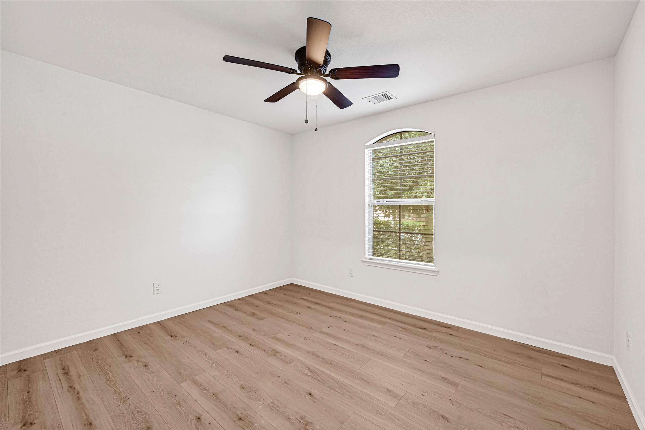 23343 Dukes Run Drive Spring, TX 77373 - Photo 14 of 21 wooden floor in an empty room with a window