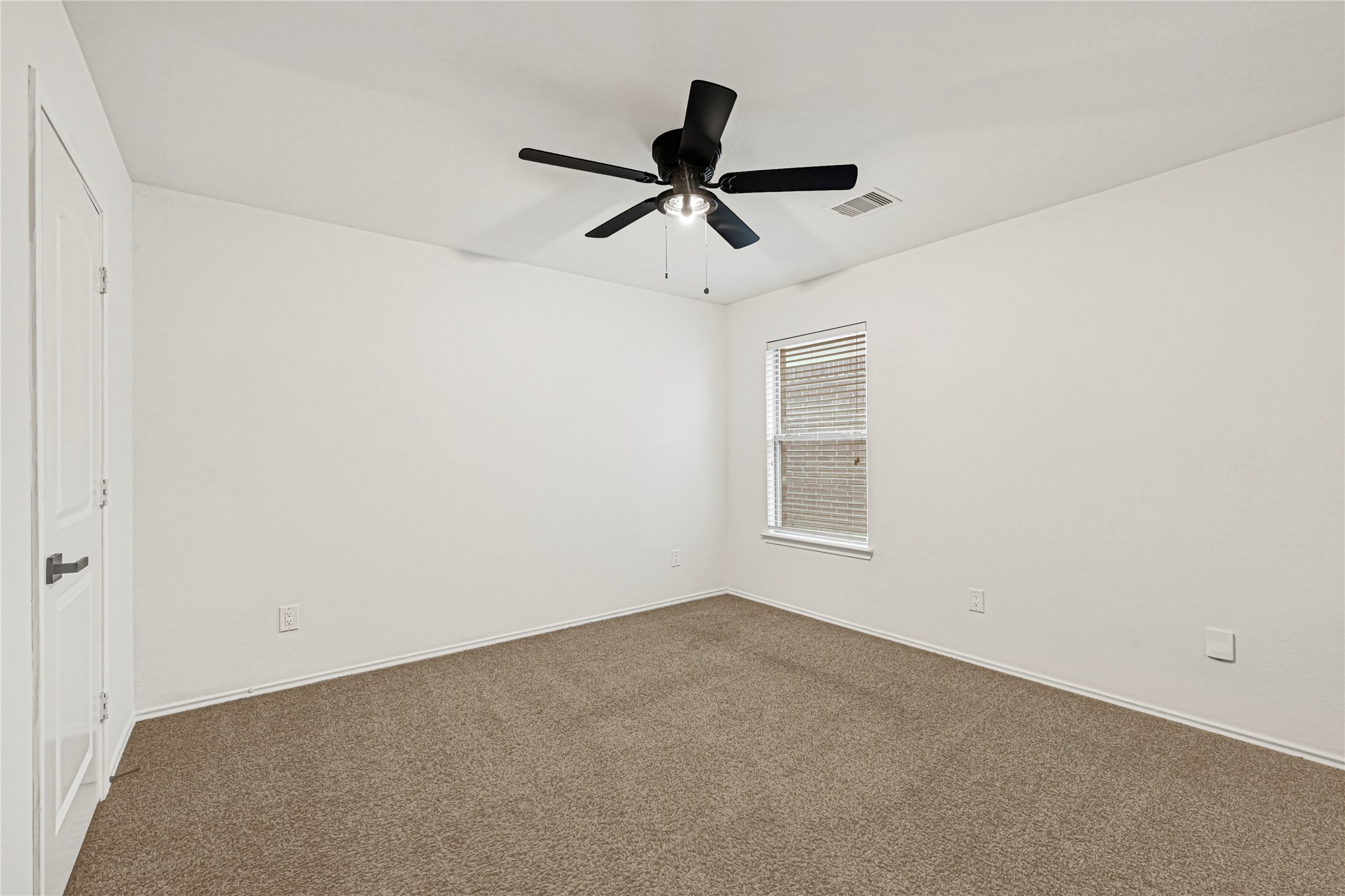 23343 Dukes Run Drive Spring, TX 77373 - Photo 16 of 21 a view of a room with a ceiling fan and window