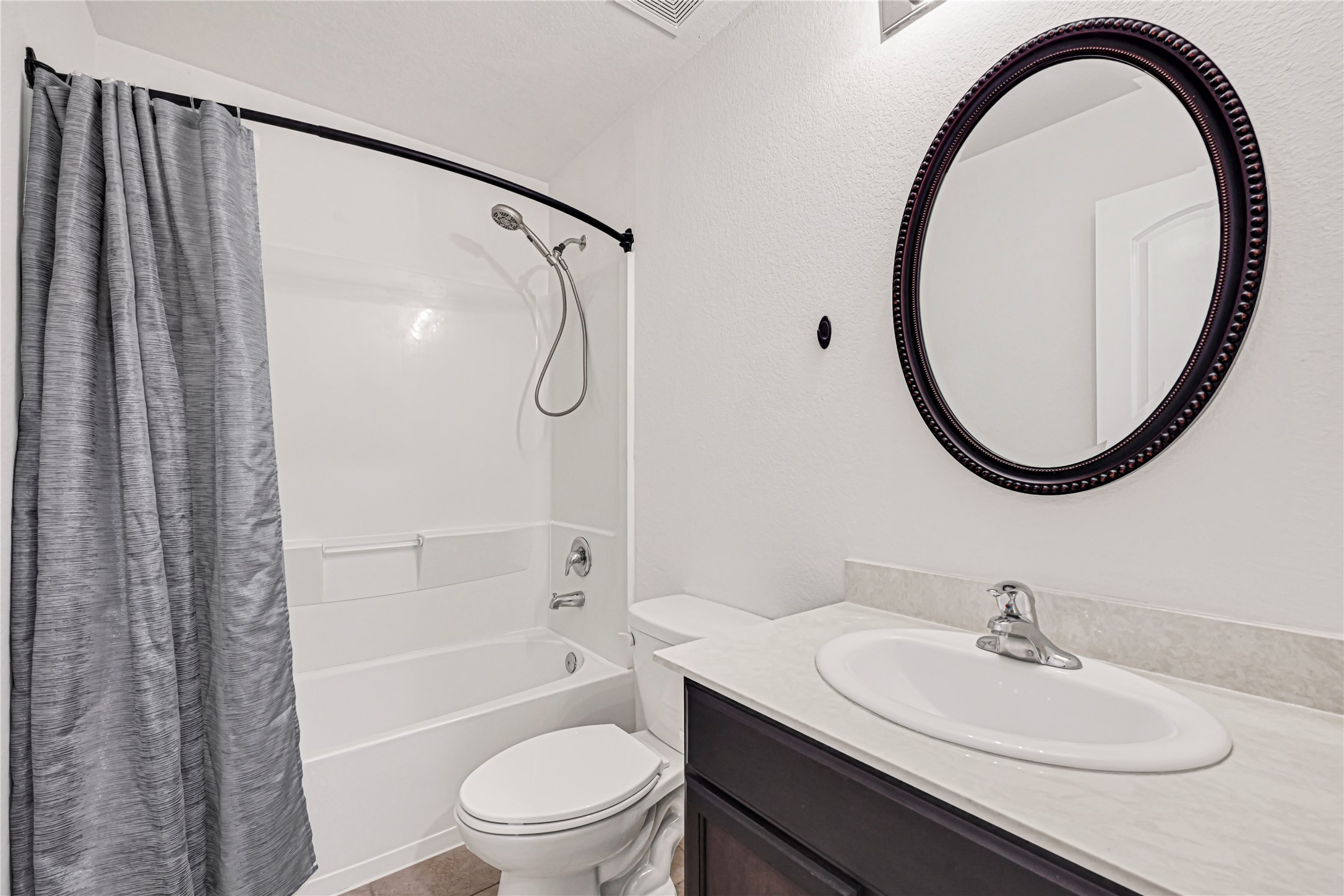 23343 Dukes Run Drive Spring, TX 77373 - Photo 17 of 21 a bathroom with a sink a toilet and a mirror
