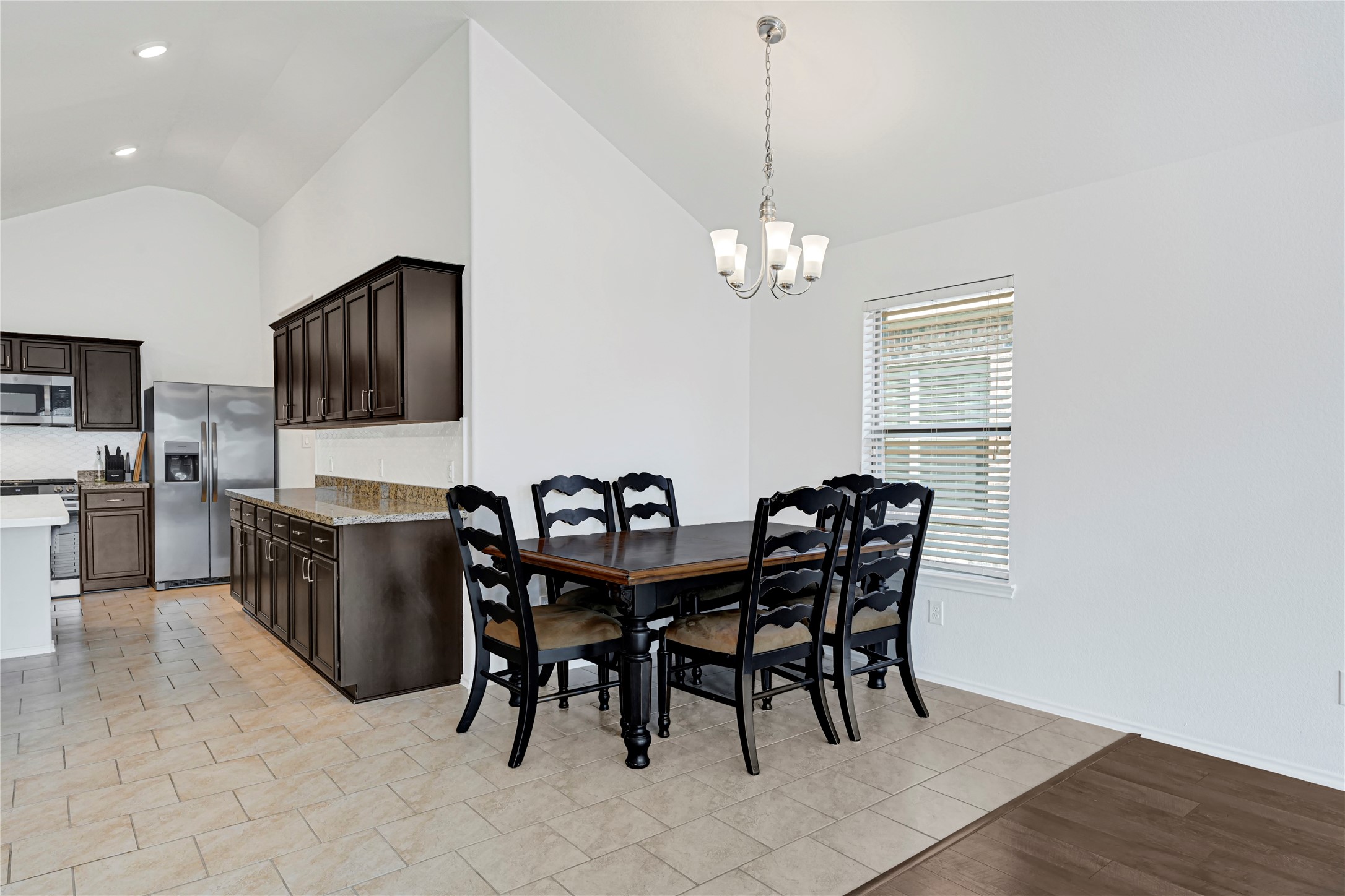 23343 Dukes Run Drive Spring, TX 77373 - Photo 7 of 21 a view of a dining room with furniture and wooden floor