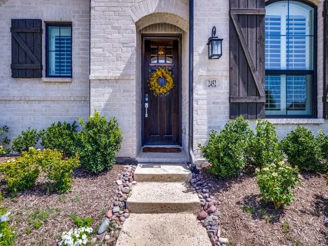 a front view of a house with glass windows