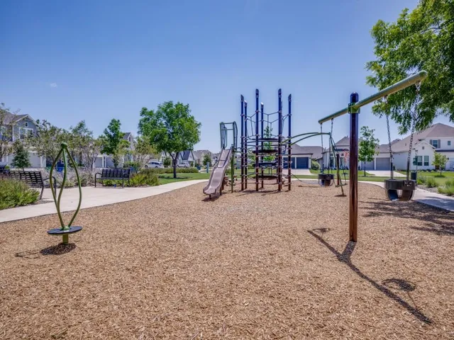 a view of a park with swings