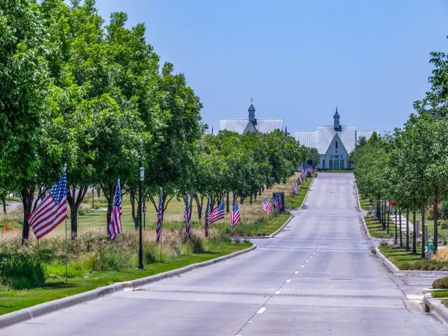 a view of park with large trees
