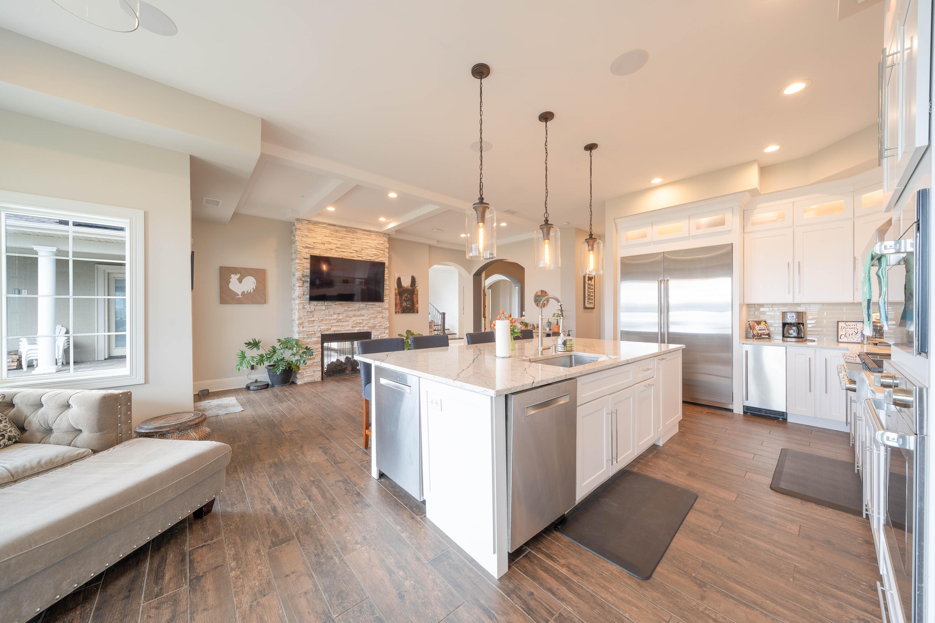 13941 Lakeview Point Road Cedar Lake, IN 46303 - Photo 12 of 64 a large kitchen with kitchen island a large island a sink a stove and a wooden floors