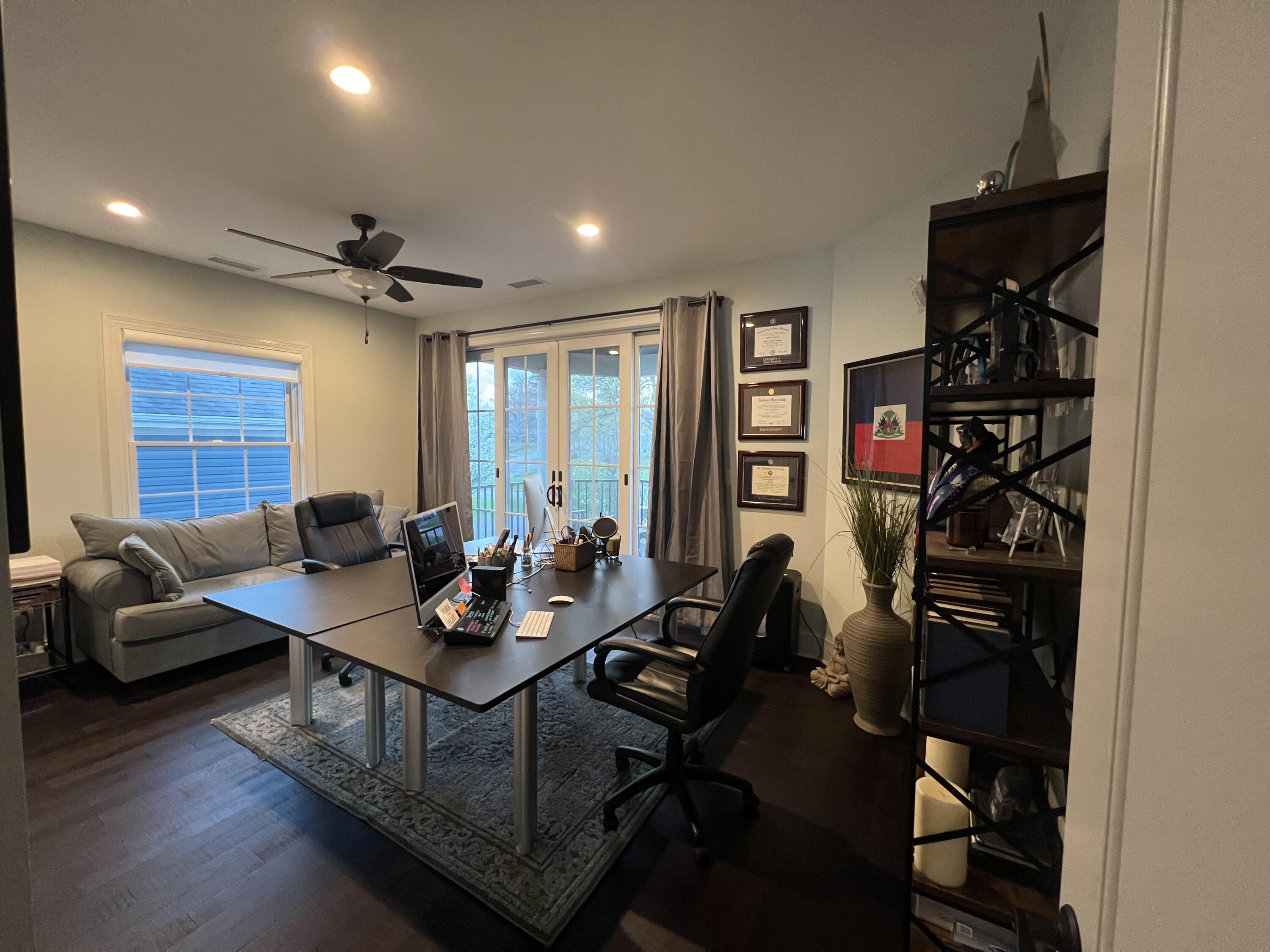 13941 Lakeview Point Road Cedar Lake, IN 46303 - Photo 37 of 64 a living room with furniture a large window and gym equipment
