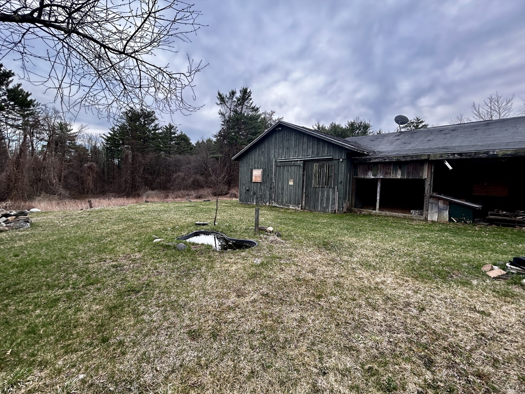 267 Osborne Road Ware, MA 01082 - Photo 6 of 10 a view of a house with a yard and a large tree