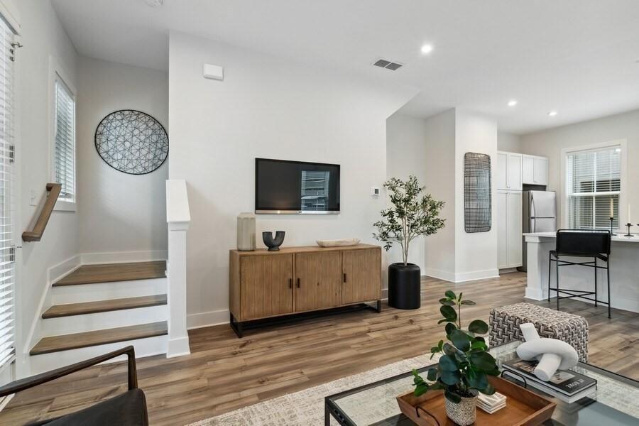 776 Metropolitan Parkway Southwest, Unit 3A Atlanta, GA 30310 - Photo 8 of 22 a living room with furniture a flat screen tv and a fireplace
