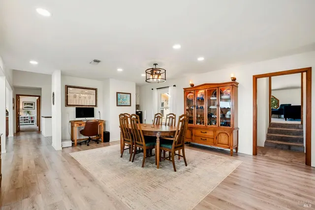 a kitchen with stainless steel appliances a stove a sink and a refrigerator