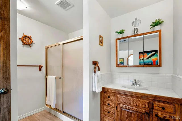 a bedroom with a bed and a bookshelf