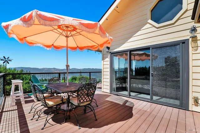 a wooden bench with view of trees