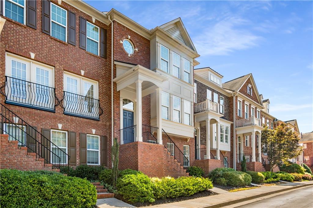 2767 Loftview Square, Unit 8 Atlanta, GA 30339 - Photo 1 of 1 a view of a brick building next to a yard