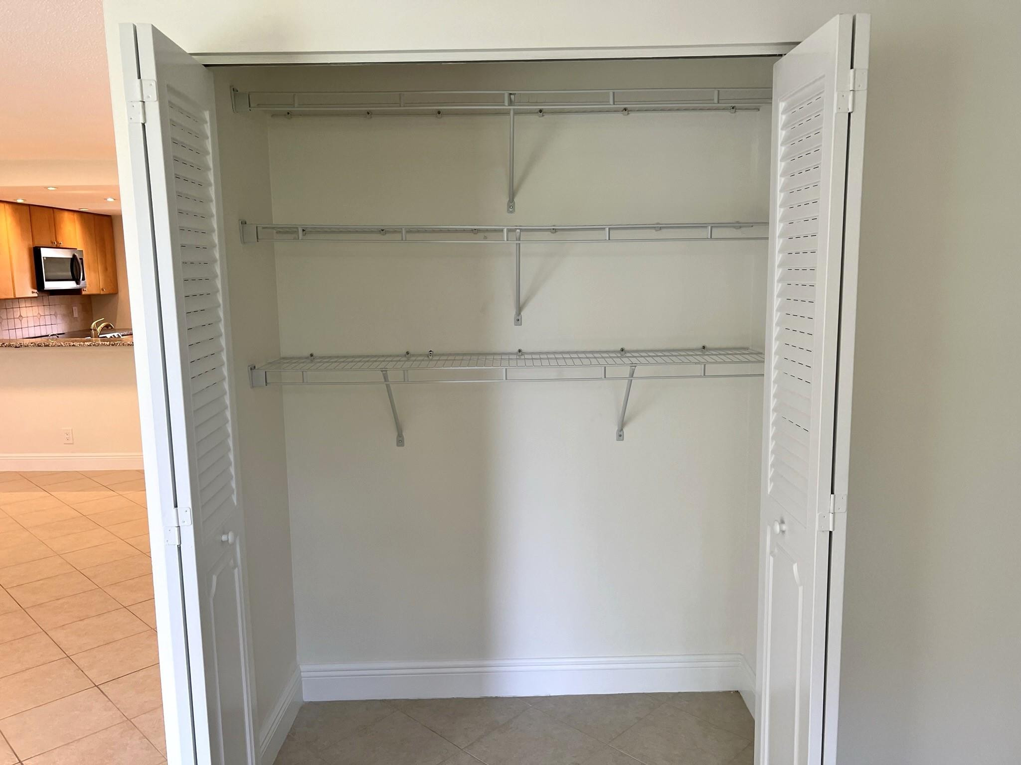 5700 Northwest 2nd Avenue, Unit 204 Boca Raton, FL 33487 - Photo 11 of 31 a view of a room with racks on the wall