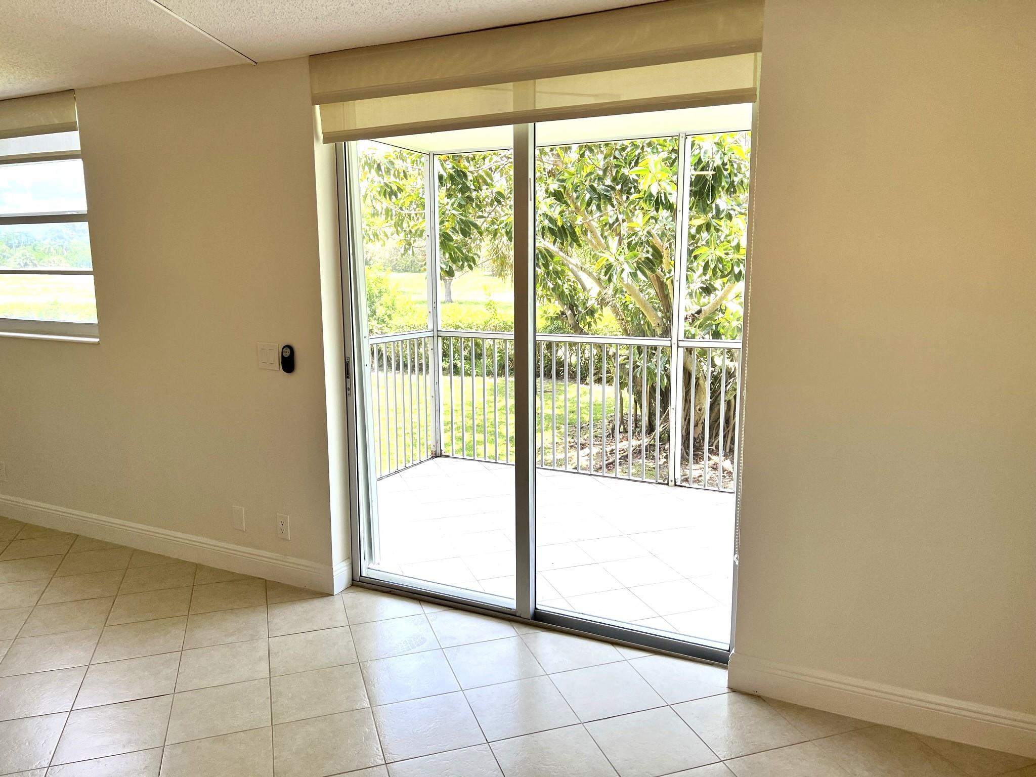 5700 Northwest 2nd Avenue, Unit 204 Boca Raton, FL 33487 - Photo 12 of 31 a view of a room with a large window