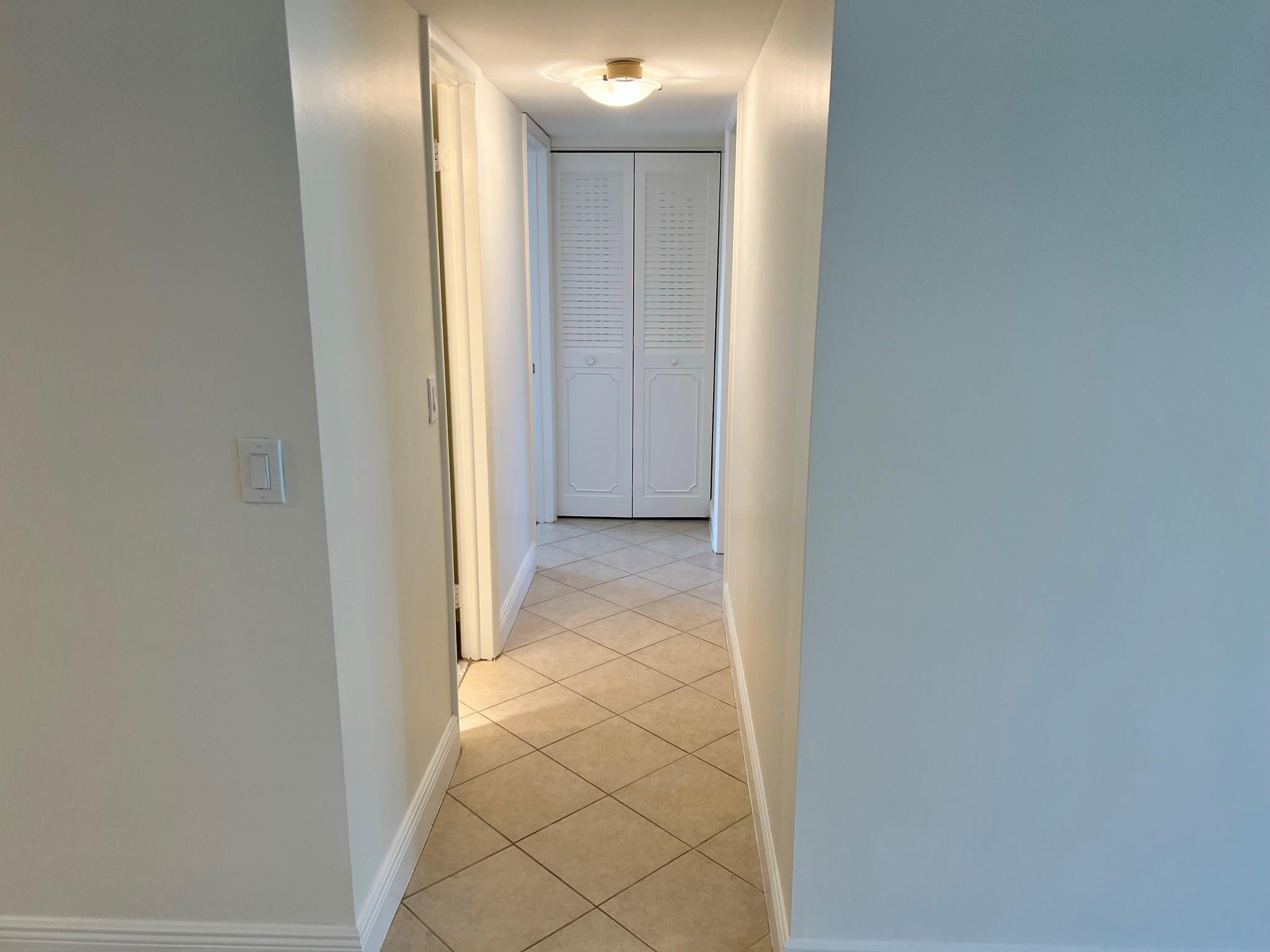 5700 Northwest 2nd Avenue, Unit 204 Boca Raton, FL 33487 - Photo 15 of 31 a view of a hallway