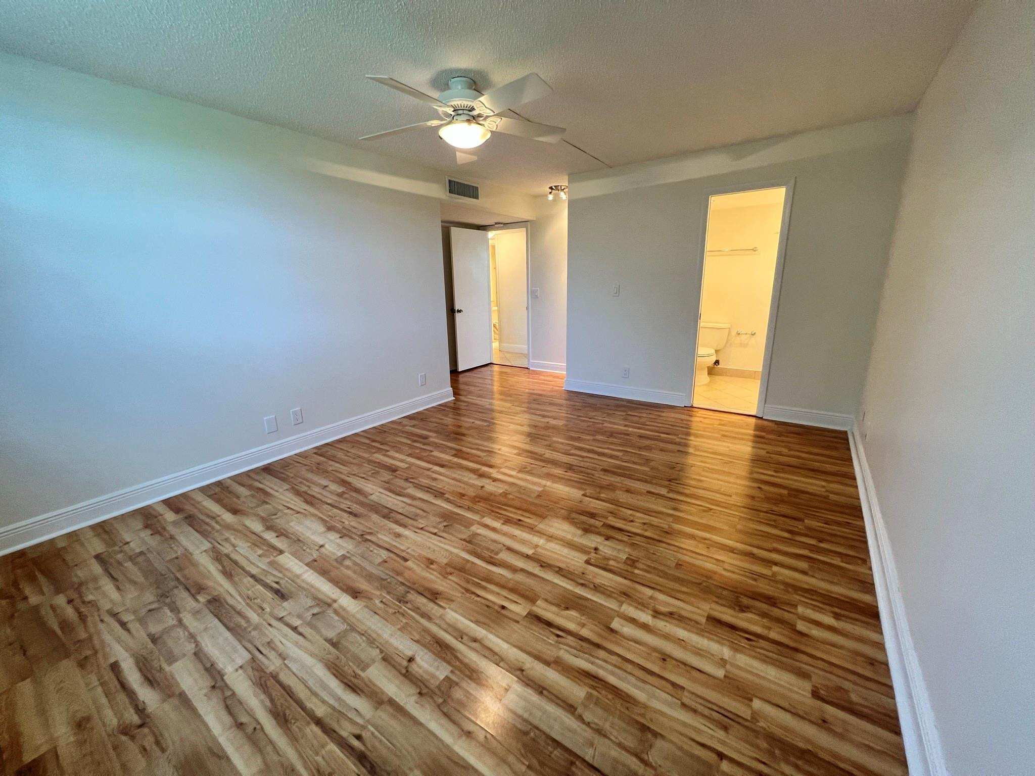 5700 Northwest 2nd Avenue, Unit 204 Boca Raton, FL 33487 - Photo 21 of 31 wooden floor in an empty room with a window