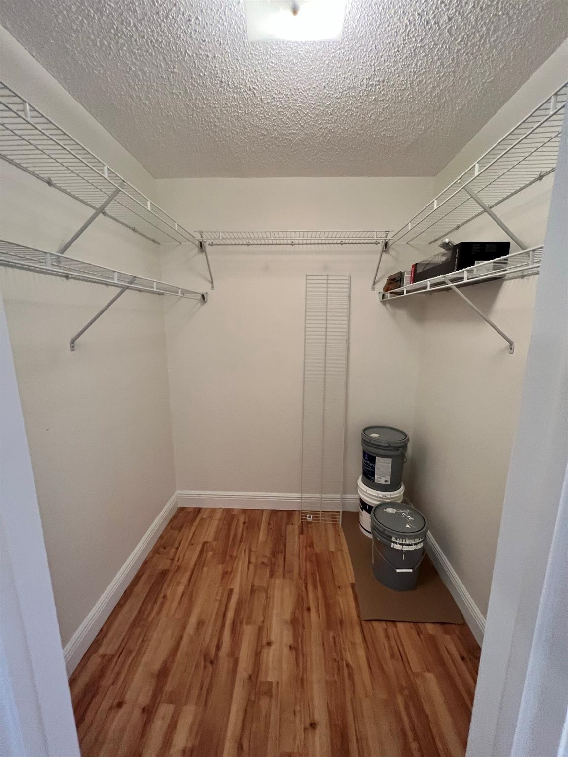 5700 Northwest 2nd Avenue, Unit 204 Boca Raton, FL 33487 - Photo 22 of 31 a view of a room with wooden floor
