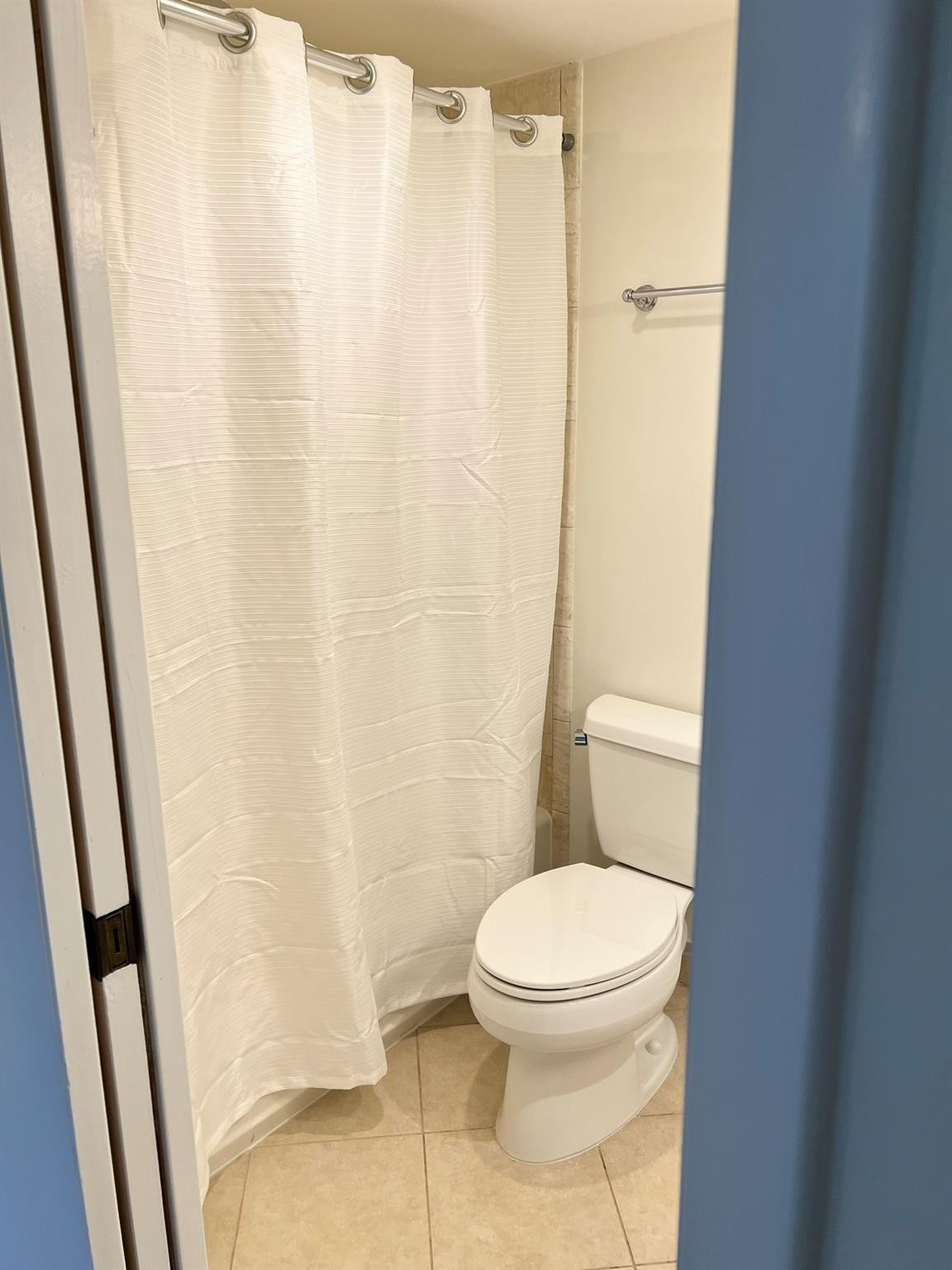 5700 Northwest 2nd Avenue, Unit 204 Boca Raton, FL 33487 - Photo 24 of 31 a white toilet sitting next to a shower