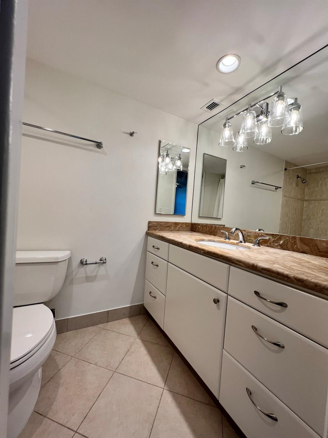 5700 Northwest 2nd Avenue, Unit 204 Boca Raton, FL 33487 - Photo 26 of 31 a spacious bathroom with a toilet sink and mirror
