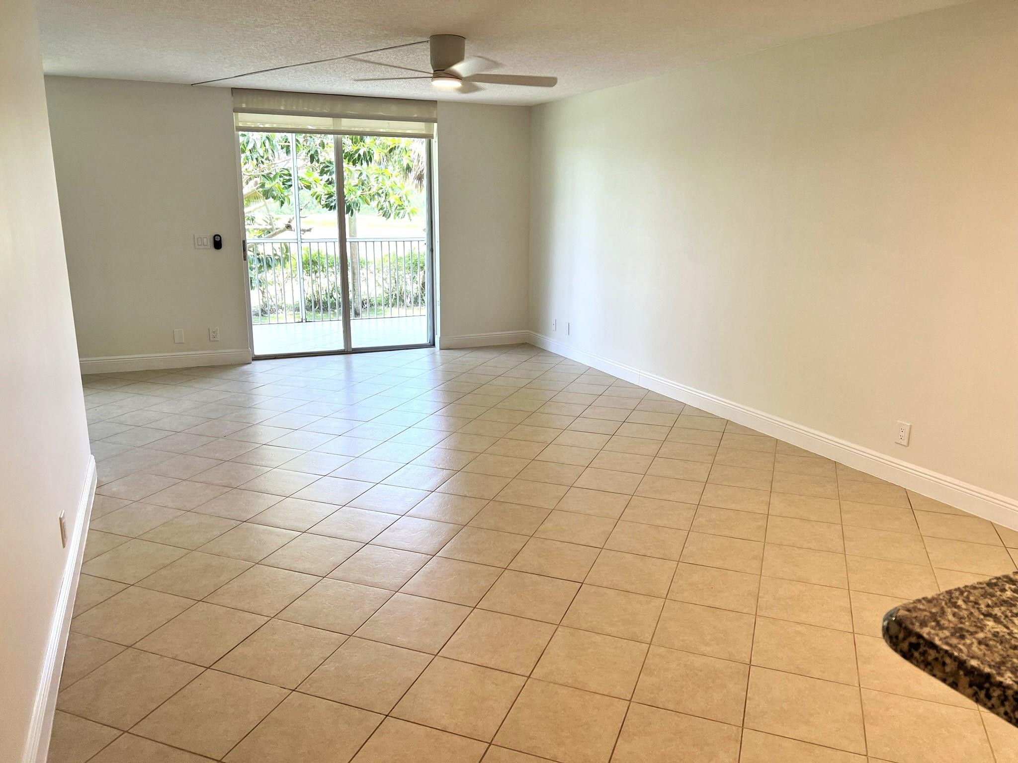 5700 Northwest 2nd Avenue, Unit 204 Boca Raton, FL 33487 - Photo 7 of 31 an empty room with windows