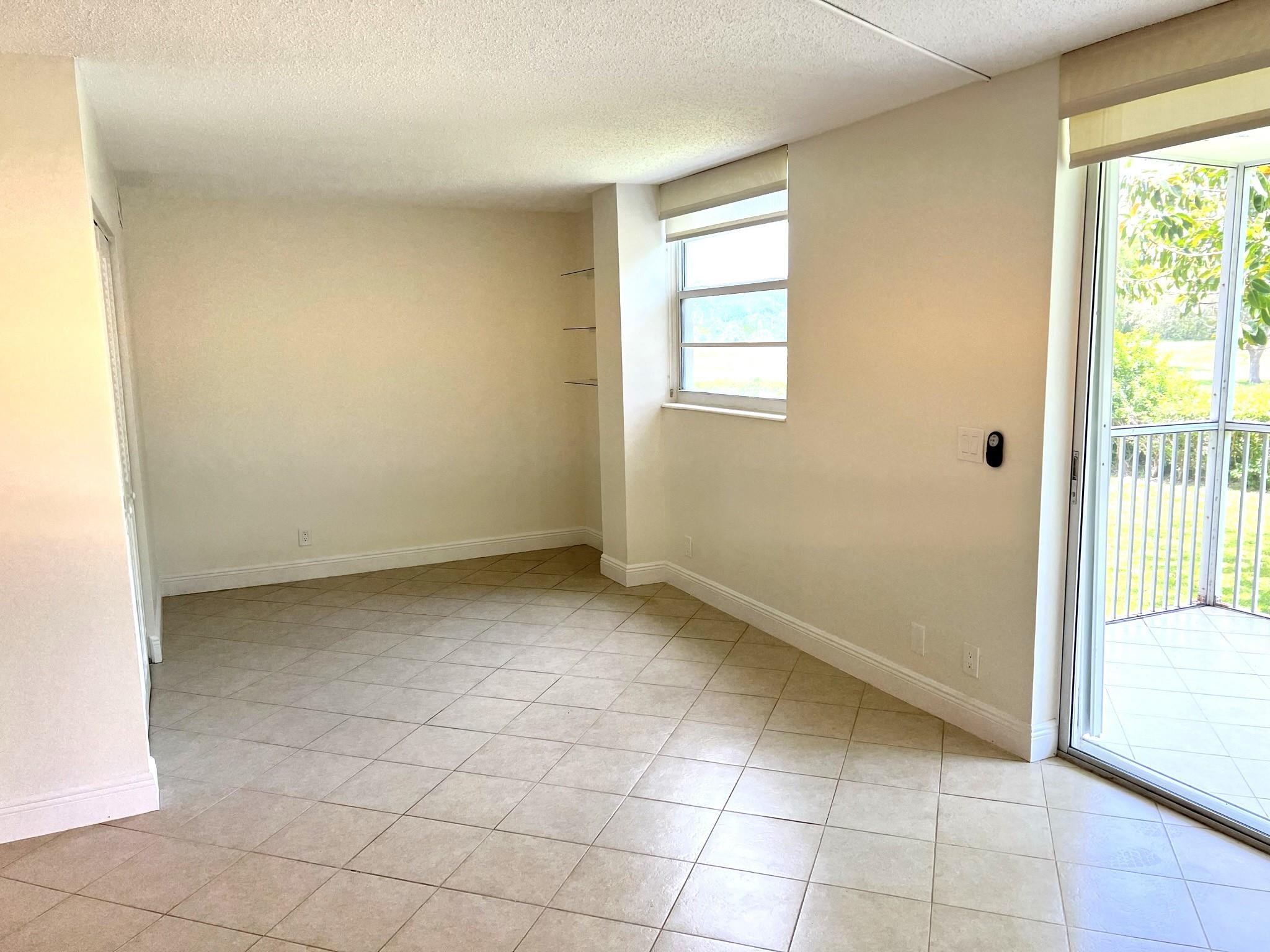5700 Northwest 2nd Avenue, Unit 204 Boca Raton, FL 33487 - Photo 8 of 31 a view of a room that has a window in it