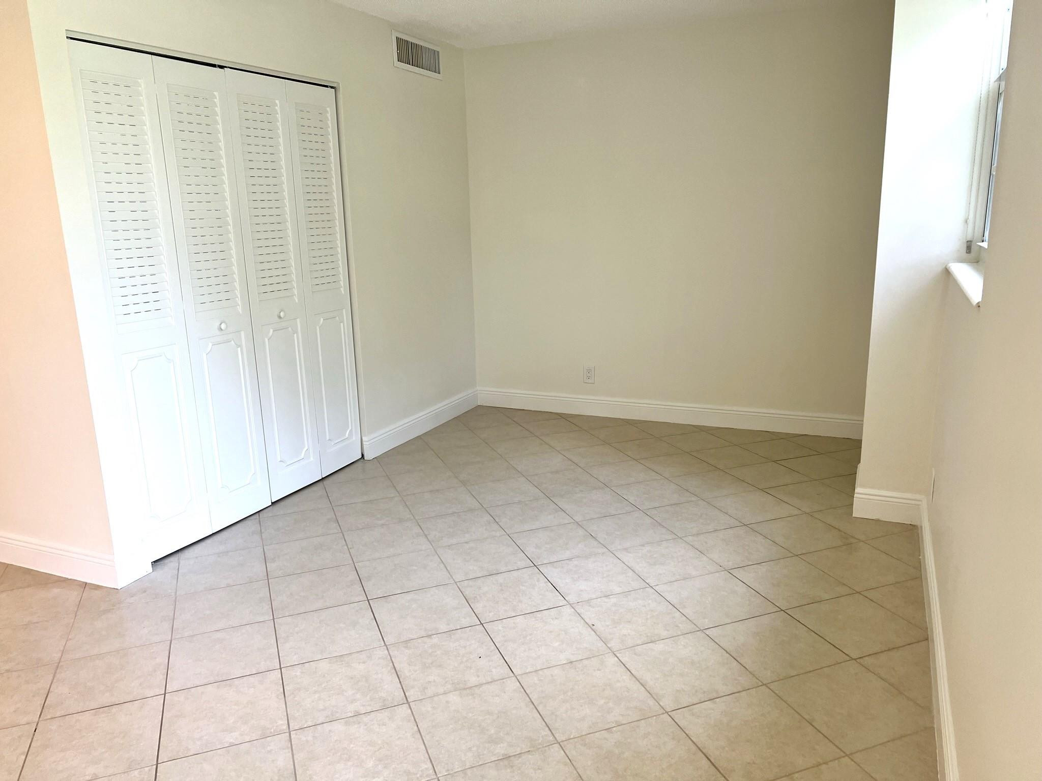 5700 Northwest 2nd Avenue, Unit 204 Boca Raton, FL 33487 - Photo 9 of 31 a view of an empty room