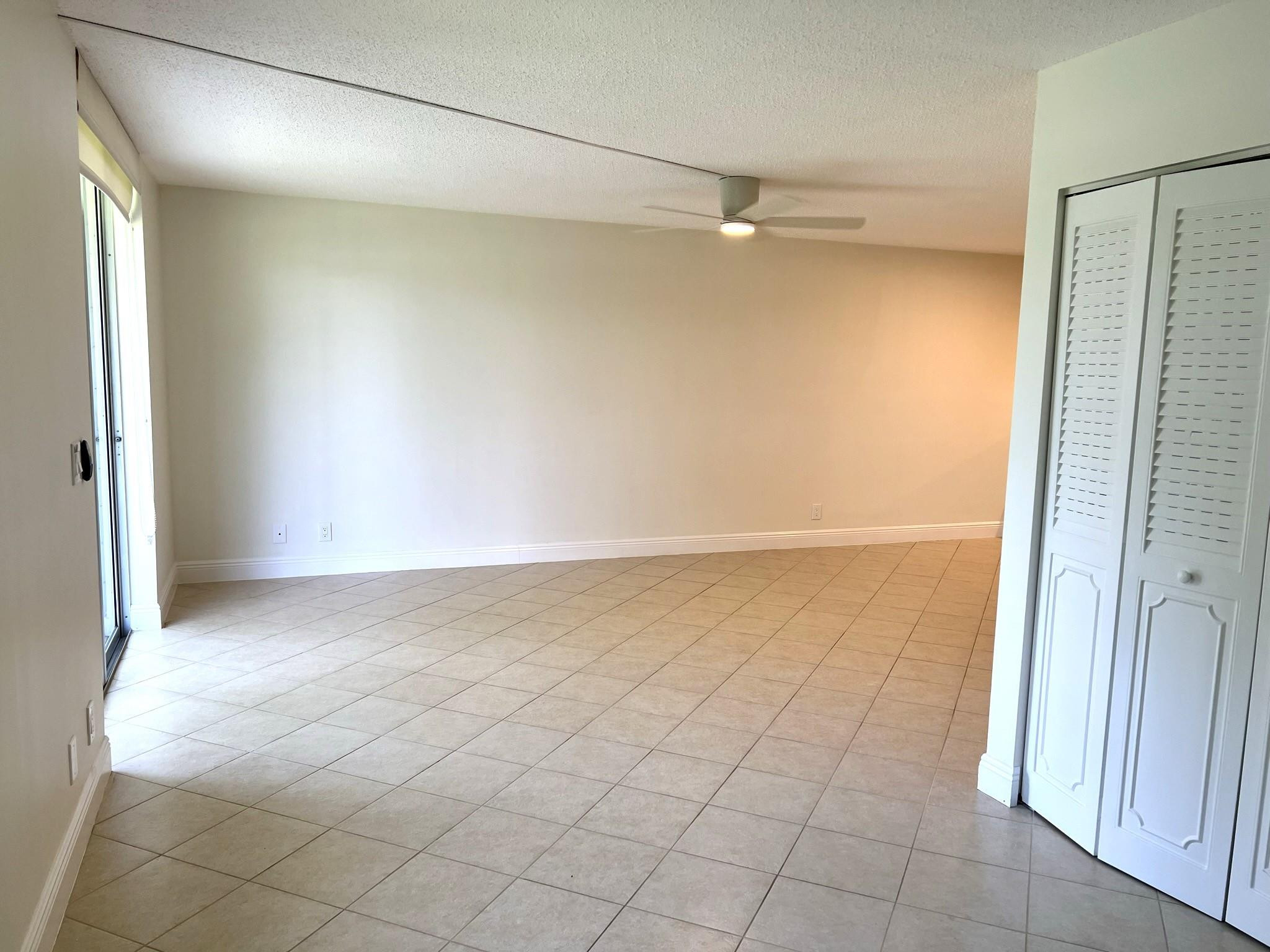 5700 Northwest 2nd Avenue, Unit 204 Boca Raton, FL 33487 - Photo 10 of 31 a view of an empty room and a window