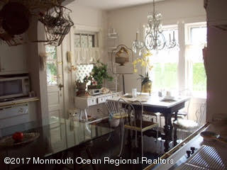 24 Heyers Mill Road Colts Neck, NJ 07722 - Photo 6 of 12 a view of a dining room with furniture window and outside view