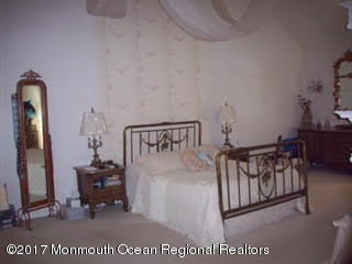 24 Heyers Mill Road Colts Neck, NJ 07722 - Photo 9 of 12 a view of a hallway with a livingroom