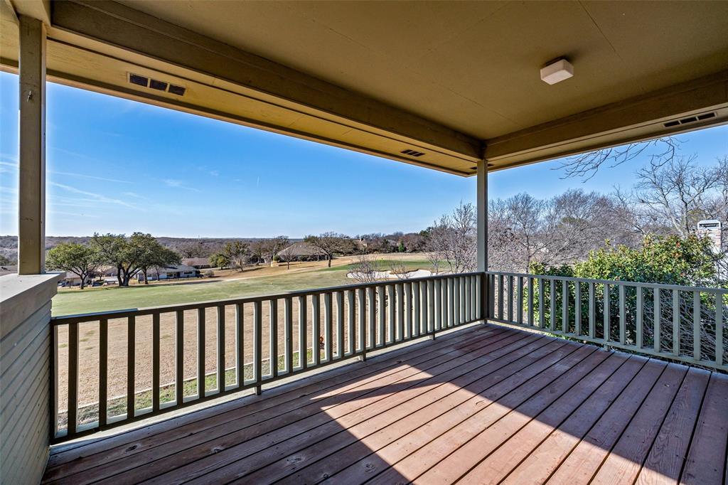 8908 Brierfield Road Granbury, TX 76049 - Photo 34 of 40 a view of a balcony with wooden floor