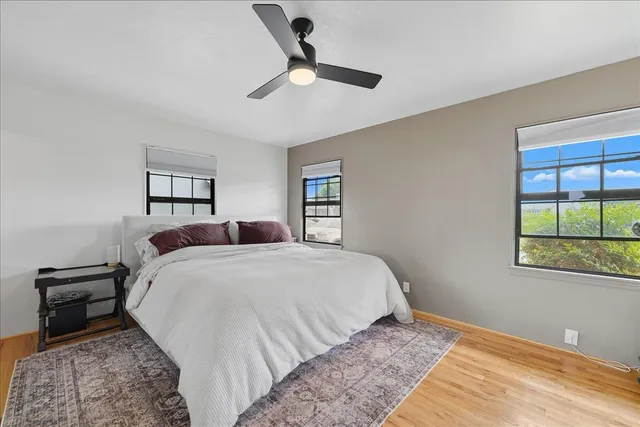 a bed room with a bed and a window