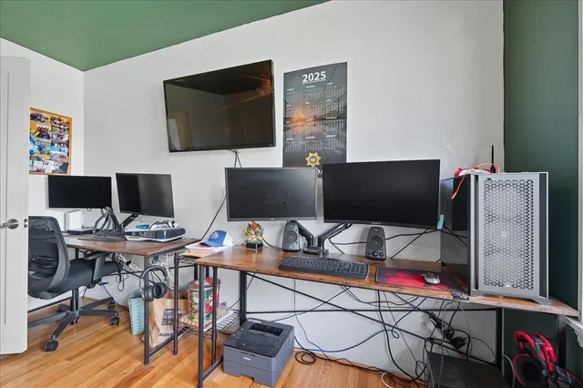 a workspace with furniture and wooden floor