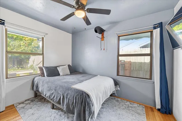 a bedroom with a large bed and a window
