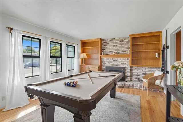 a dining room with table and chairs