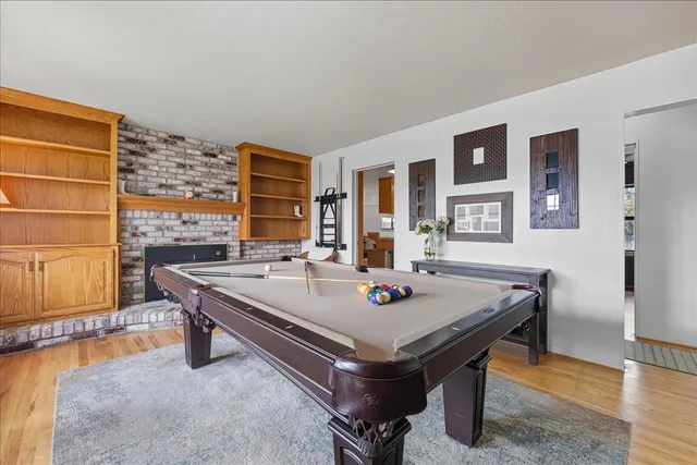 a view of a workspace with furniture and bathroom