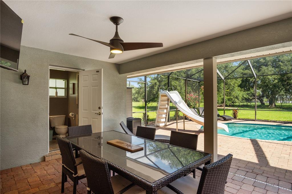 9045 Lake Hatchineha Road Kissimmee, FL 34759 - Photo 13 of 47 a view of a dining room with furniture window and outside view