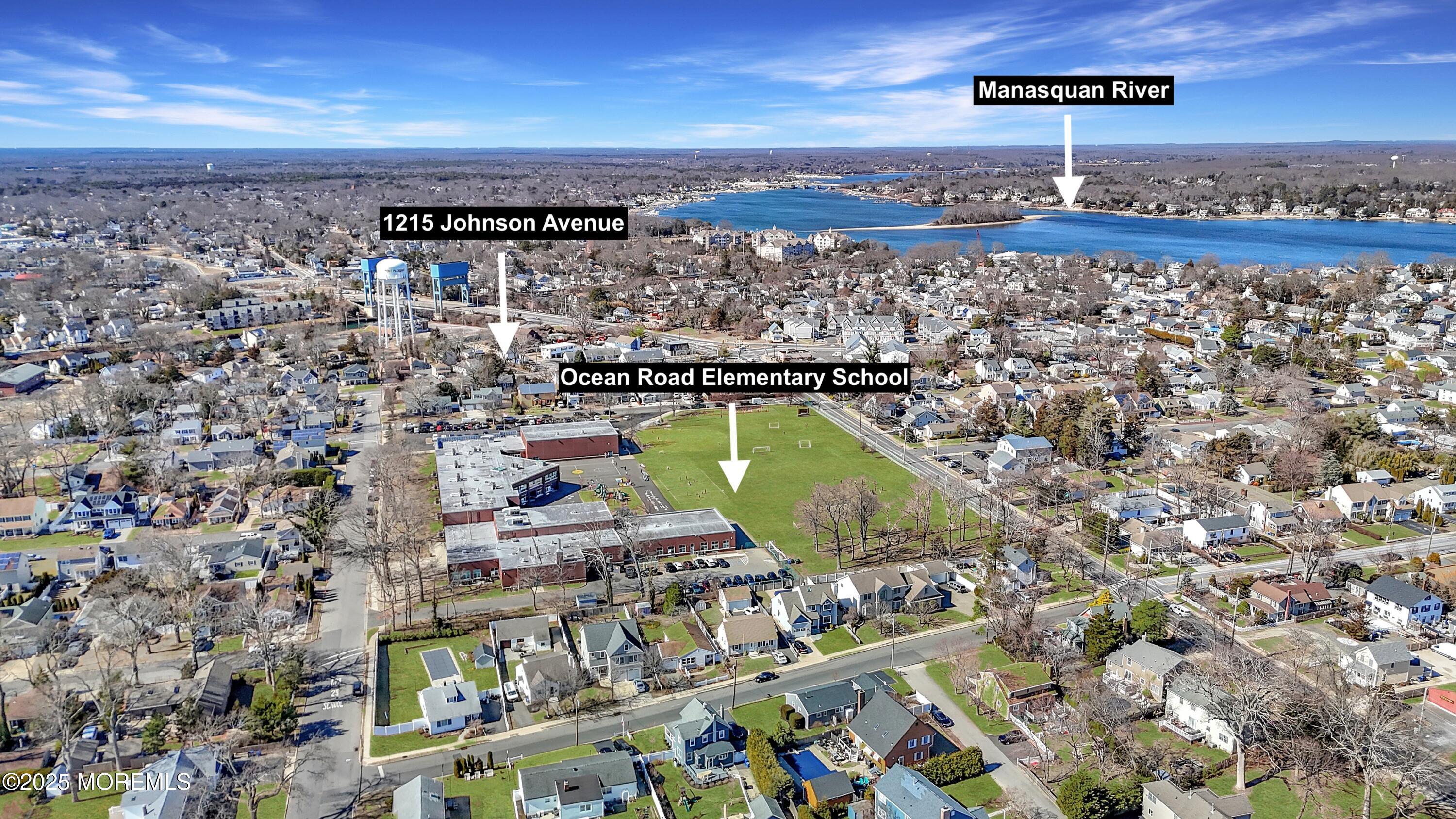 an aerial view of a house with a ocean view
