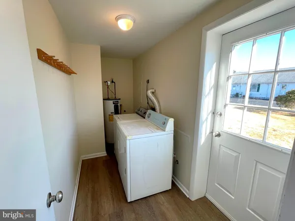 a utility room with a window dryer and washer