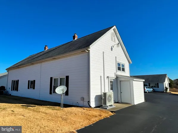 a front view of a house with garage