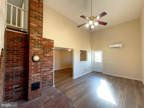 a view of a livingroom with wooden floor