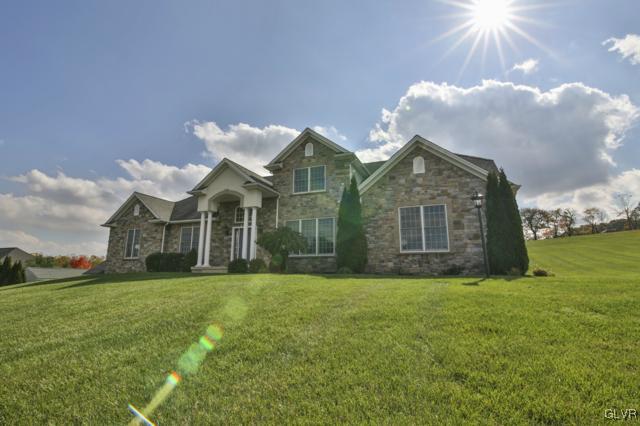 297 Meyer Road Nazareth, PA 18064 - Photo 2 of 41 a view of a house next to a big yard with plants and large trees