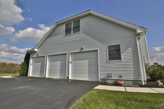 297 Meyer Road Nazareth, PA 18064 - Photo 5 of 41 a front view of a house with a yard and garage