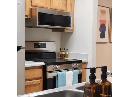 a kitchen with a stove and a microwave